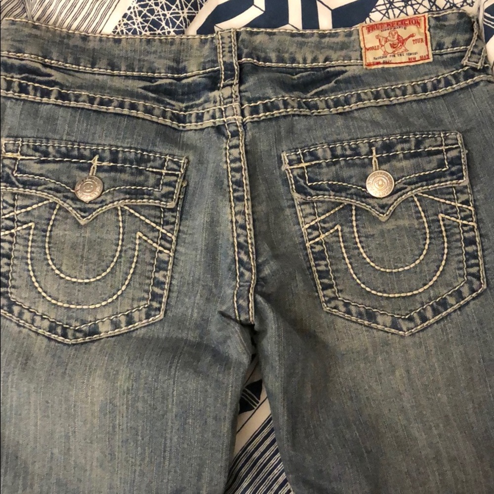 True Religion light-wash straight-leg jeans.